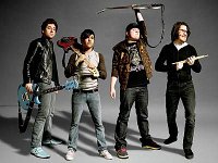 Fall Out Boy  Bass player Pete Wentz wearing low cut optical white chucks.